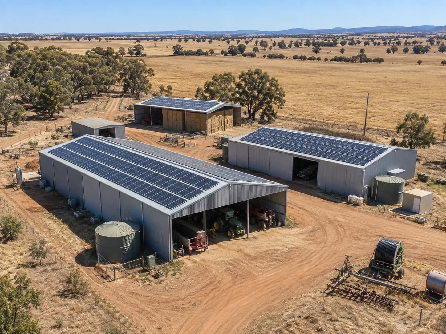 Large agricultural sheds with rooftop solar on rural farmland