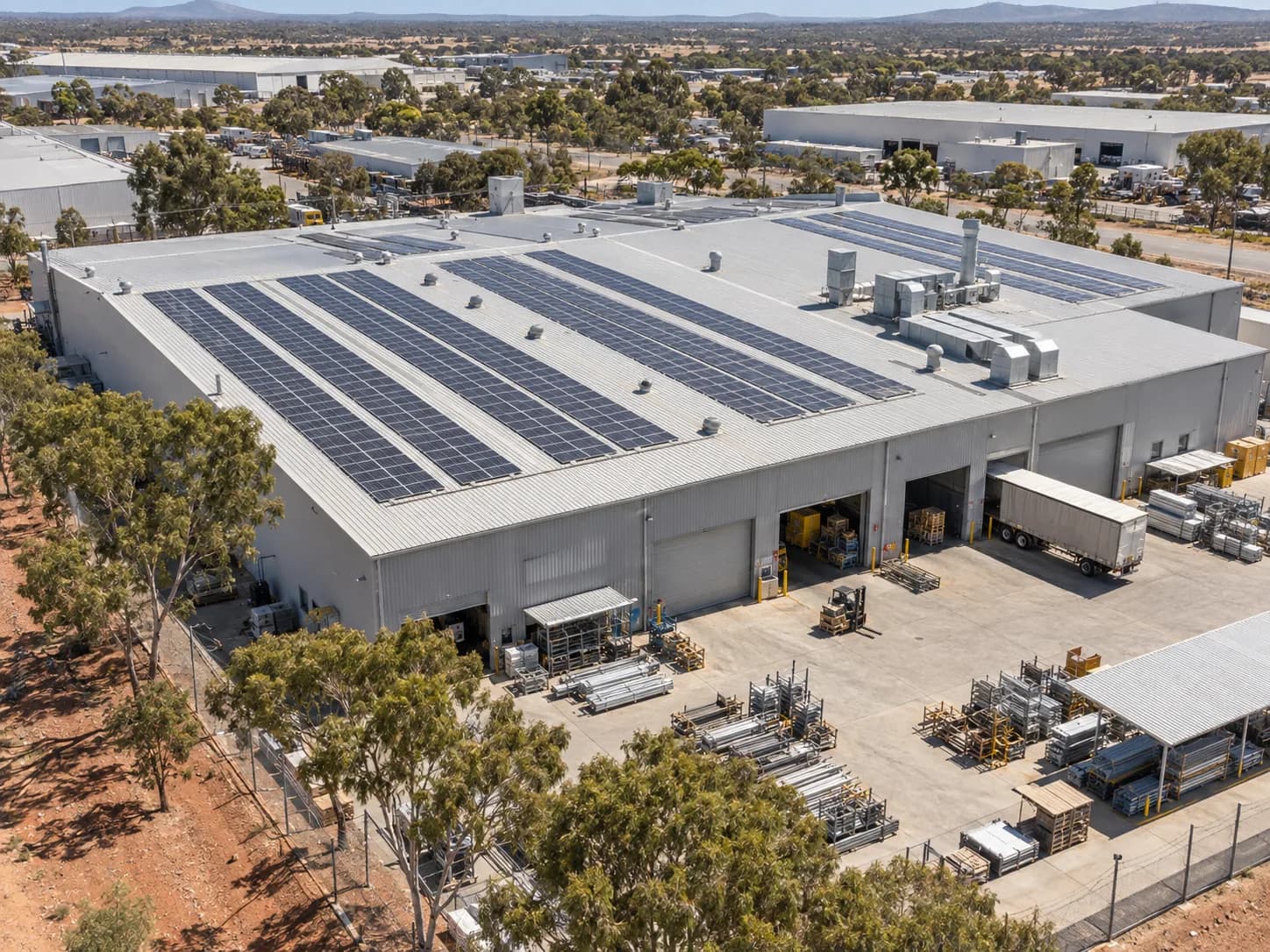 An industrial manufacturing facility with solar panels across the roof